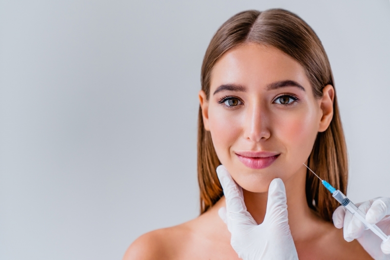 Woman getting BOTOX in jaw for TMJ in Calgary, CA