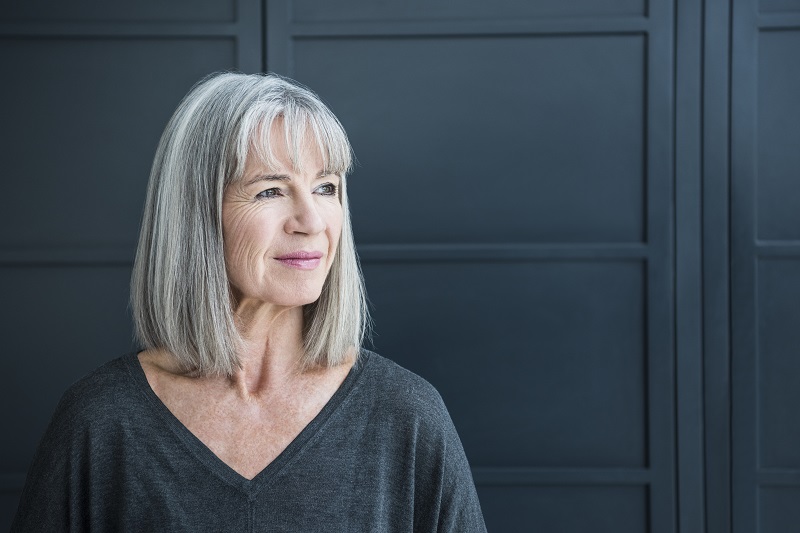 Woman thinking about dental implants