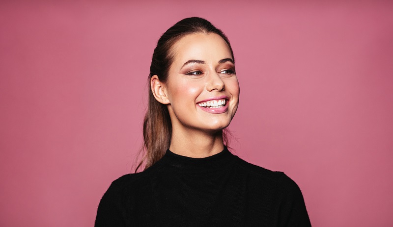 Woman with porcelain veneers in Calgary