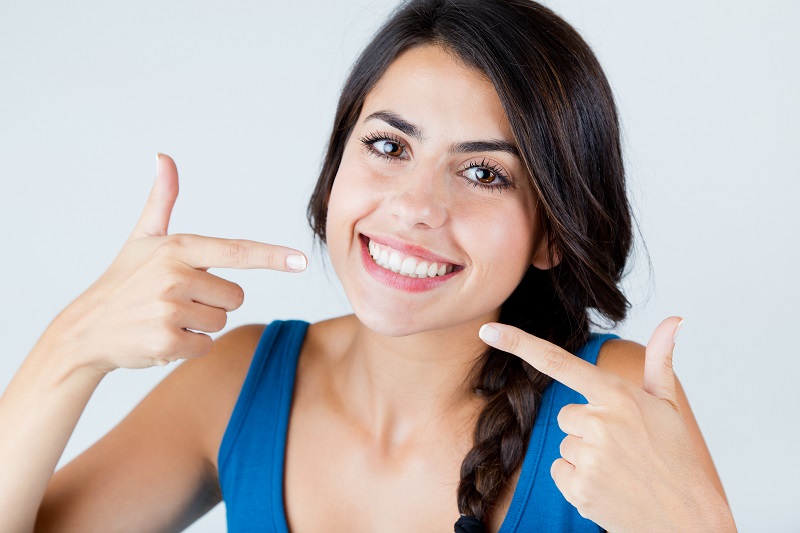 Woman smiling after her smile makeover at Aesthetic Dental Studio 