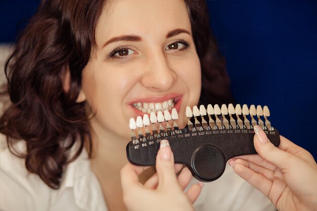smiling-woman-with-healthy-teeth-whitening-dental-care-concept