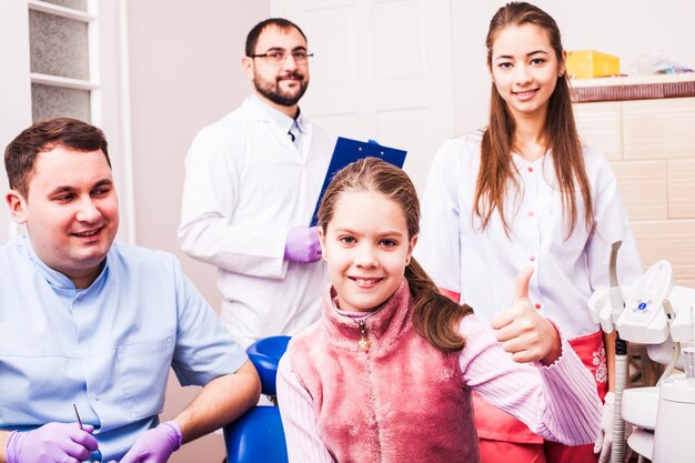 teenage-girl-dental-clinic-diagnosis-bite-fix-dentist-technician-team