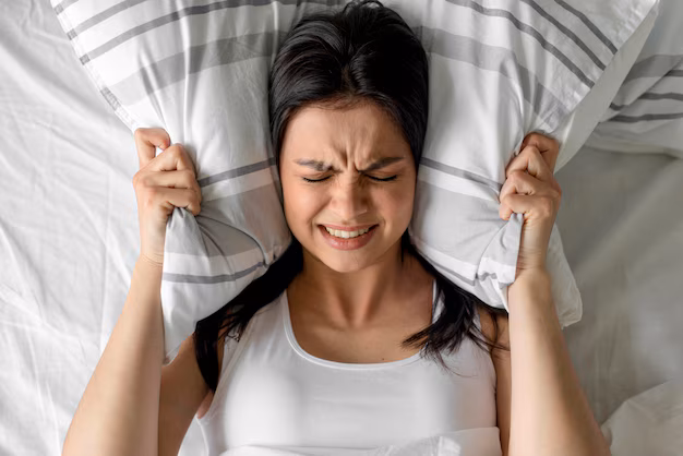top-view-young-woman-holding-pillow-bed