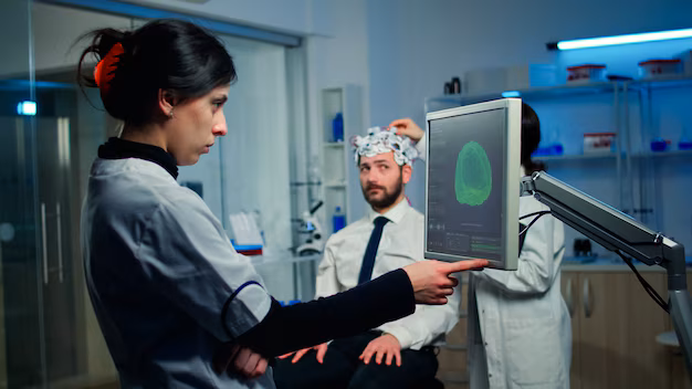woman-researcher-looking-monitor-analysing-brain-scan-while-coworker-discussing-with-patient-background-about-side-effects