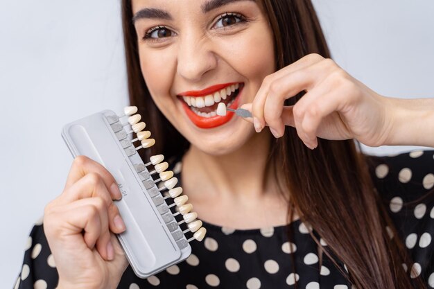 young-woman-brushing-her-teeth-with-manual-toothbrush-closeup